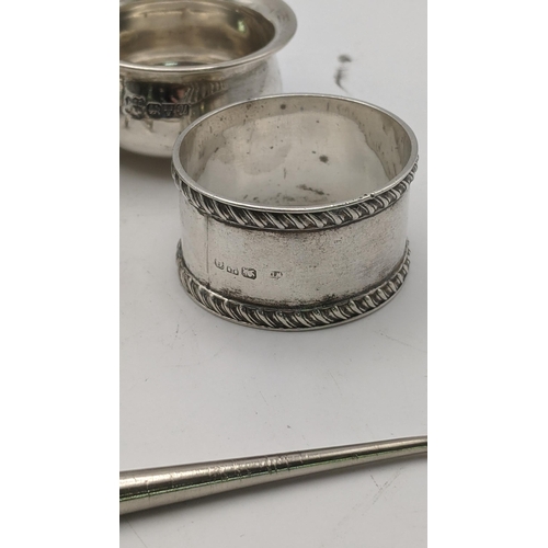 131 - Silver to include condiment pots, sugar tongs, a napkin ring and silver handled button hook, total w... 