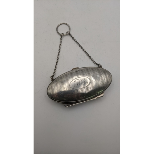 132 - A silver purse with engraved initials and chain, hallmarked Birmingham 1916
Location: CAB 8
If there... 