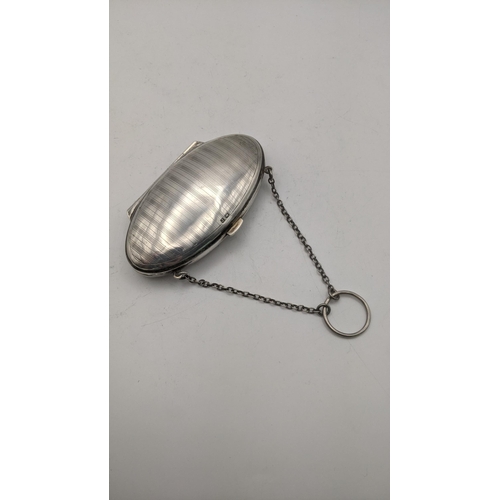 132 - A silver purse with engraved initials and chain, hallmarked Birmingham 1916
Location: CAB 8
If there... 