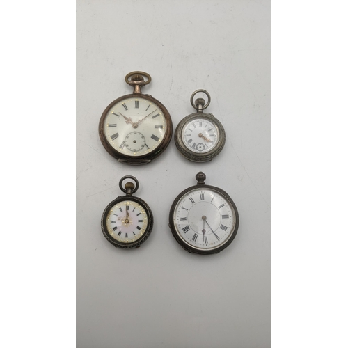 138 - An early 20th century silver open faced keyless wound pocket watch together with three fob watches
L... 