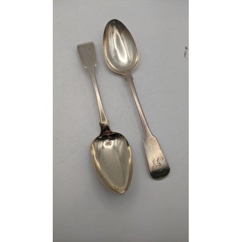 139 - Two silver fiddle pattern serving spoons, one hallmarked London 1813, total weight 121.4g
Location: ... 