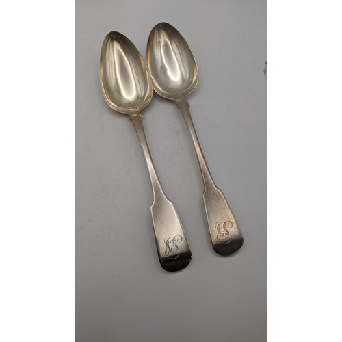 139 - Two silver fiddle pattern serving spoons, one hallmarked London 1813, total weight 121.4g
Location: ... 