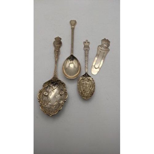 145 - A group of silver commemorative spoons to include two floral embossed examples and one other, togeth... 