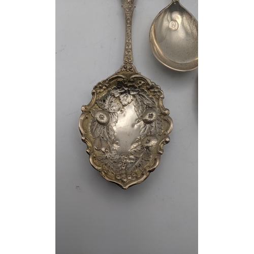 145 - A group of silver commemorative spoons to include two floral embossed examples and one other, togeth... 