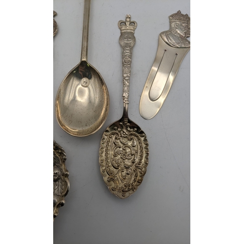 145 - A group of silver commemorative spoons to include two floral embossed examples and one other, togeth... 