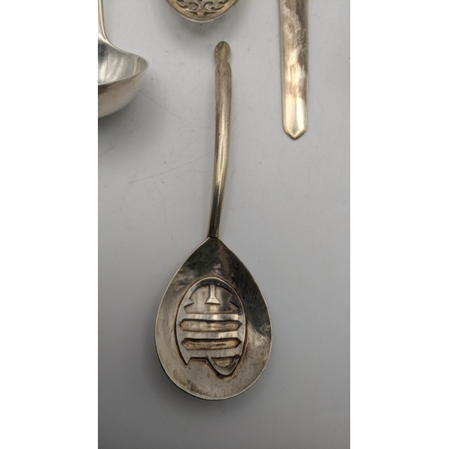 146 - Silver utensils to include a sauce ladle, sugar scoop, sugar sifter and one other together with a le... 