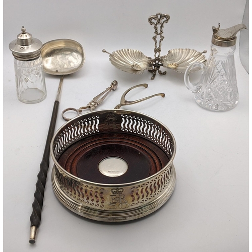 149 - Silver to include a wine coaster, sugar nips, wishbone tongs, a white metal twin bon bon dish, toget... 