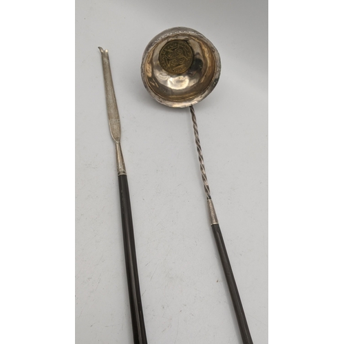 155 - A silver toddy ladle together with a toddy ladle handle
Location: A3B
If there is no condition repor... 