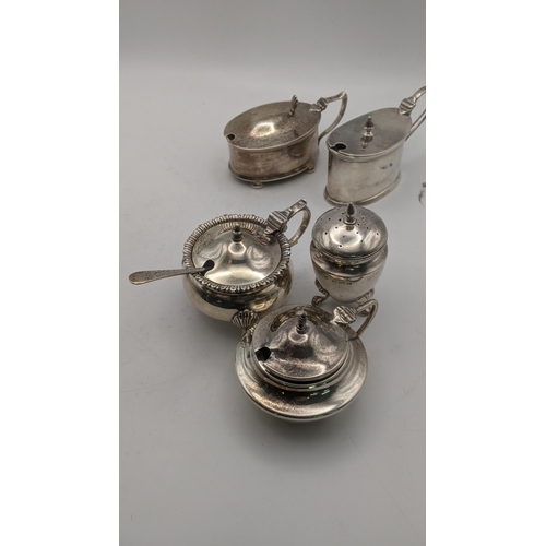 161 - Two silver three piece condiment sets, one set hallmarked Sheffield 1937, and the other hallmarked B... 