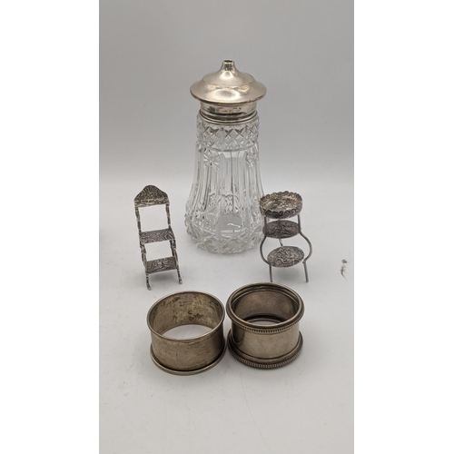 162 - Silver to include miniature furniture made by David Bell having embossed decoration together with tw... 