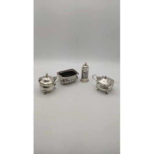 165 - Silver condiments to include two mustard pots, a pepper pot and a salts total weight total weight ex... 