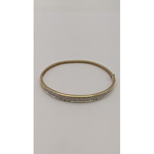 18 - A 9ct gold an diamond hinged bracelet 10.1g
Location: CAB 9
If there is no condition report shown, p... 