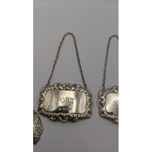 19 - Four silver decanter labels to include a pair of hallmarked Sheffield 1987 inscribed 'Port' and 'She... 