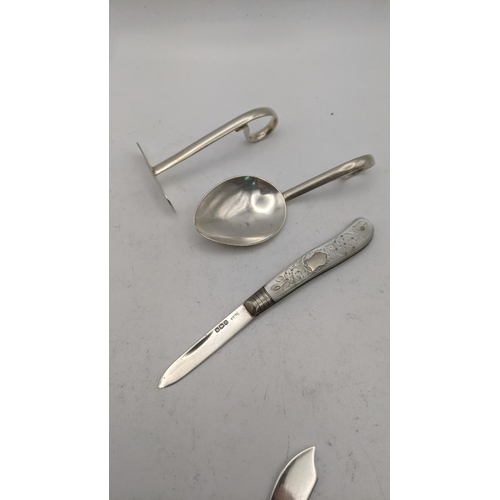 23 - Silver to include an Edwin Joseph Houlston christening spoon and pusher, a common prayer book, a sil... 