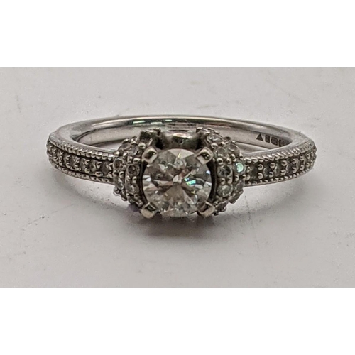 29 - A 18ct white gold and diamond ring with a certificate of authenticity, 4.7g, size M 1/2
Location: CA... 