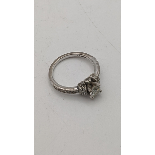 29 - A 18ct white gold and diamond ring with a certificate of authenticity, 4.7g, size M 1/2
Location: CA... 