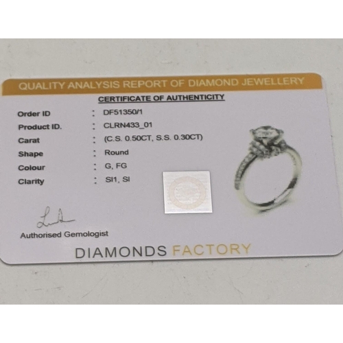 29 - A 18ct white gold and diamond ring with a certificate of authenticity, 4.7g, size M 1/2
Location: CA... 