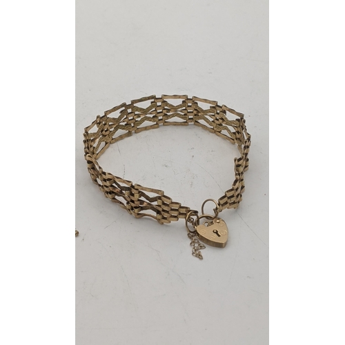 41 - A 9ct gold gate link bracelet with a padlock clasp and a pair of earrings, total weight 8.2g
Locatio... 