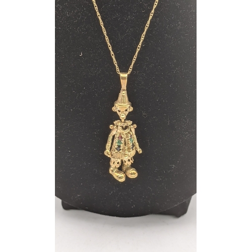 42 - A 9ct gold articulated clown pendant set with stones, total weight 6.1g, on a fine chain
Location: C... 