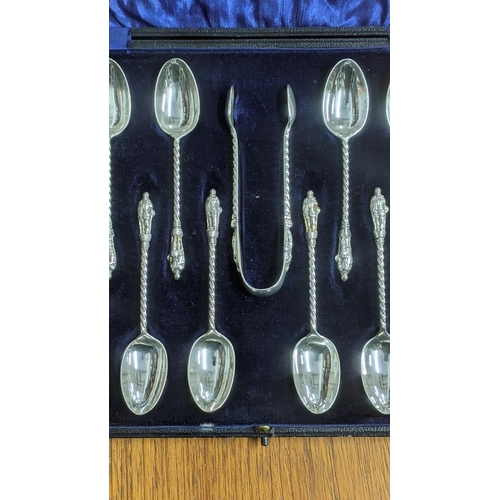 45 - Elkington and Co set of silver tea spoons and sugar tongs, having twisted columns and apostle termin... 