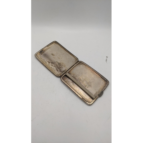 60 - A Japanese silver cigarette case having engraved detail depicting Mount Fuji signed to the back 121.... 