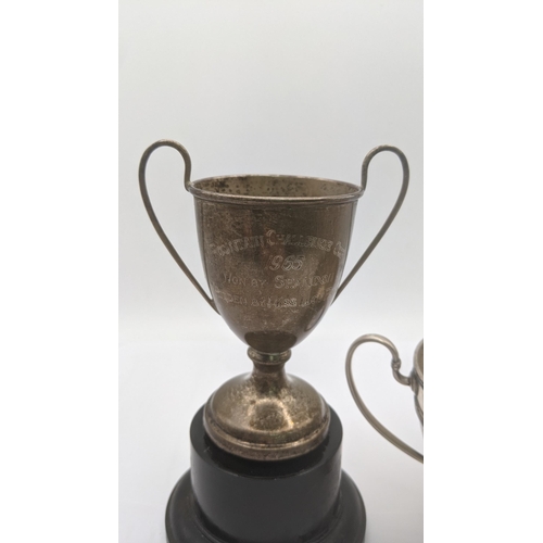 63 - Two silver trophy cups to include one example entitled to Birmingham ice rink 1933, 112.4g together ... 