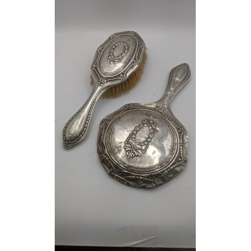 70 - A silver embossed dressing table set hallmarked Birmingham 1907
Location: R2.3
If there is no locati... 