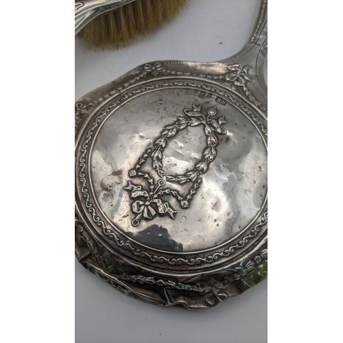 70 - A silver embossed dressing table set hallmarked Birmingham 1907
Location: R2.3
If there is no locati... 