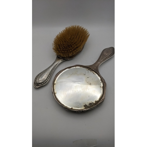 70 - A silver embossed dressing table set hallmarked Birmingham 1907
Location: R2.3
If there is no locati... 