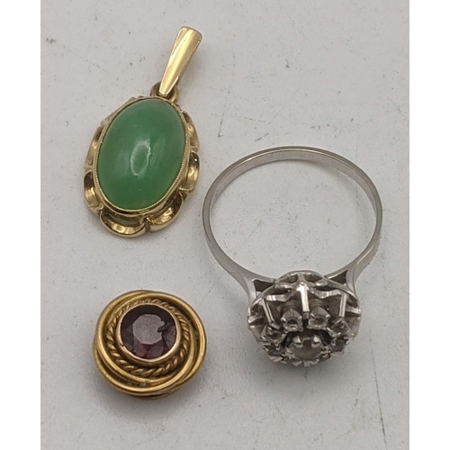 74 - Yellow and white gold to include a gold pendant set with a jade coloured stone, a white gold cluster... 