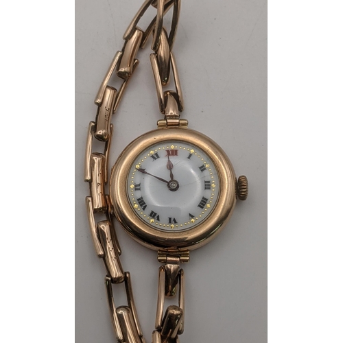 81 - A 9ct gold ladies manual wind wrist watch on a 9ct gold expanding bracelet total weight 18.8g in a f... 