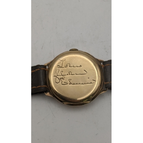 83 - A gents 9ct gold manual wind wrist watch on a brown leather strap 
Location: CAB 4
If there is no co... 