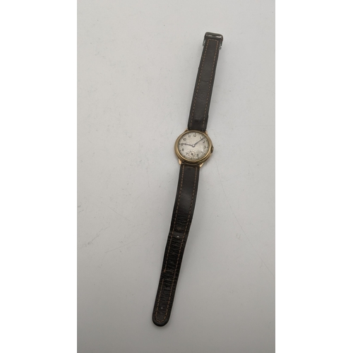 83 - A gents 9ct gold manual wind wrist watch on a brown leather strap 
Location: CAB 4
If there is no co... 