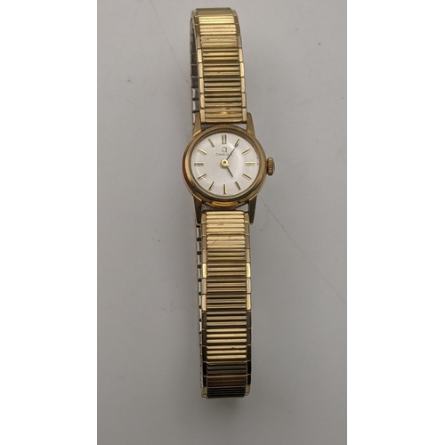 84 - A 9ct gold ladies Omega manual wind wrist watch with its box and paperwork
Location: CAB
If there is... 