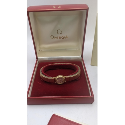 84 - A 9ct gold ladies Omega manual wind wrist watch with its box and paperwork
Location: CAB
If there is... 