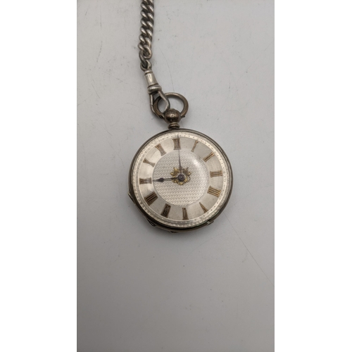 85 - A Victorian open faced ladies pocket watch on a silver pocket watch on a silver pocket watch chain h... 