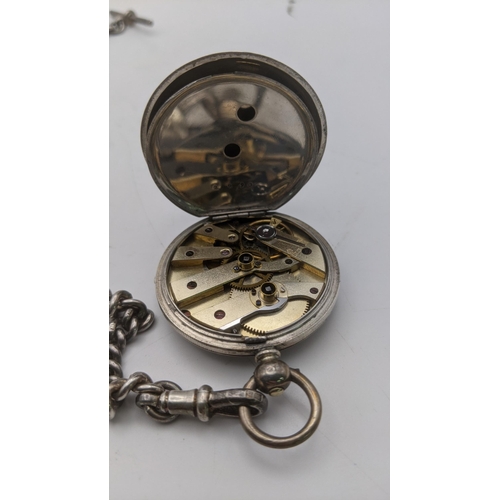 85 - A Victorian open faced ladies pocket watch on a silver pocket watch on a silver pocket watch chain h... 