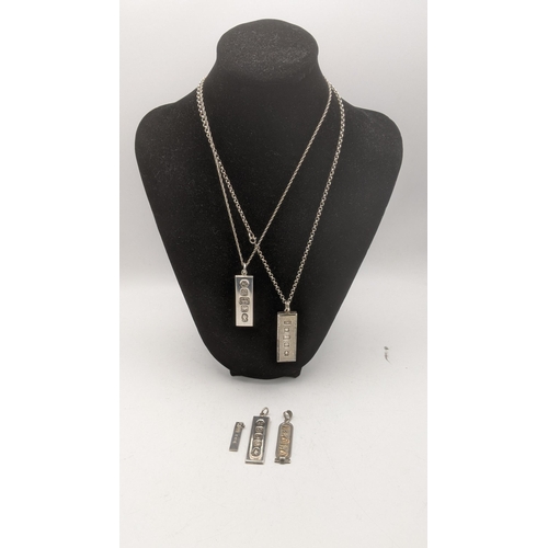 87 - 4 silver ingot pendants two on silver necklaces together with a white metal Egyptian Cartouche total... 