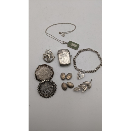 88 - Silver and white metal to include a floral engraved Vesta hallmarked Birmingham 1897 along with swee... 