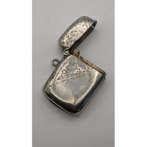 88 - Silver and white metal to include a floral engraved Vesta hallmarked Birmingham 1897 along with swee... 