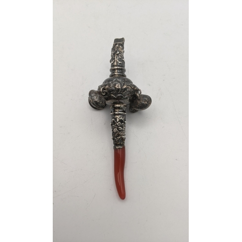 94 - A white metal and coral baby's rattle and whistle
Location: CAB 2
If there is no condition report sh... 