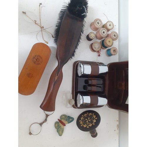 51 - A mixed lot to include vintage wooden cotton reels, clothes brushes, a gentleman's brown leather van... 