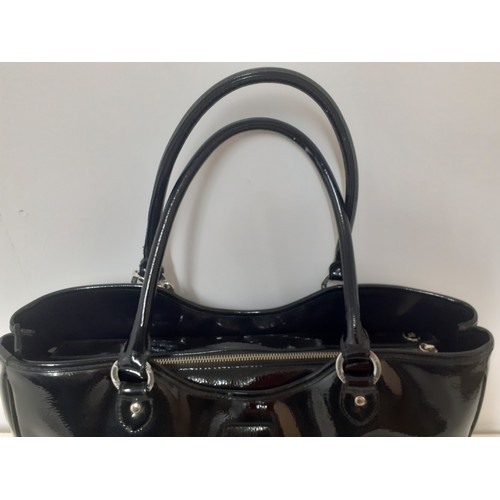 10 - Lulu Guinness- A large black patent handbag 40cm wide x 30cm high having silver tone hardware and re... 