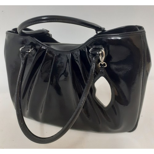 10 - Lulu Guinness- A large black patent handbag 40cm wide x 30cm high having silver tone hardware and re... 