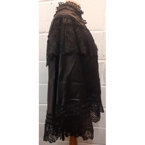 48 - A Victorian black silk and lace opera cape, approx 34