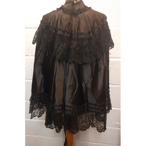 48 - A Victorian black silk and lace opera cape, approx 34