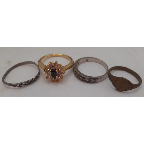 55 - A small mixed lot comprising 4 rings to include a silver and white paste stone half eternity band, a... 