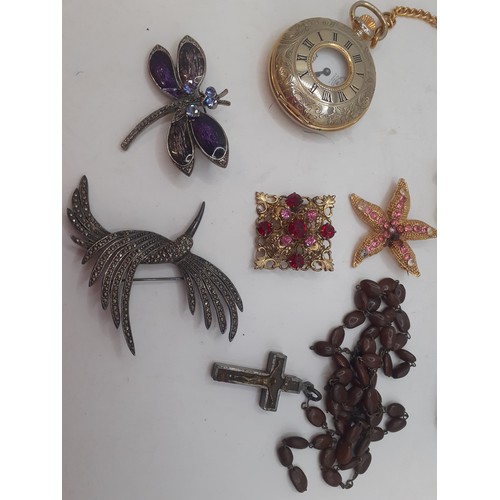 56 - A small quantity of costume jewellery and collectables to include a gold tone pocket watch, a rosary... 