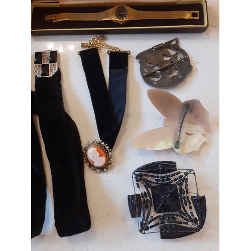 64 - A mixed lot comprising Victorian and later costume jewellery, a black velvet belt and choker, a Wehr... 