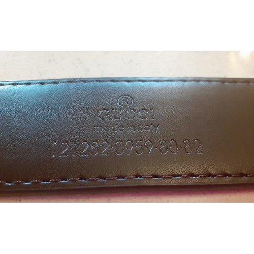 12 - THIS LOT HAS BEEN WITHDRAWN Gucci- A beige 'GG Supreme' monogram belt having a silver tone double G ... 